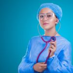 nurse putting on stethoscope